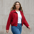 Young woman with loose hair modeling the red jacket